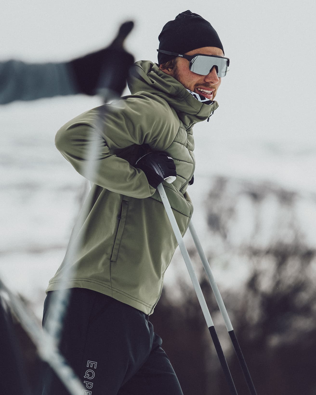 Person skiing in snowy landscape.
